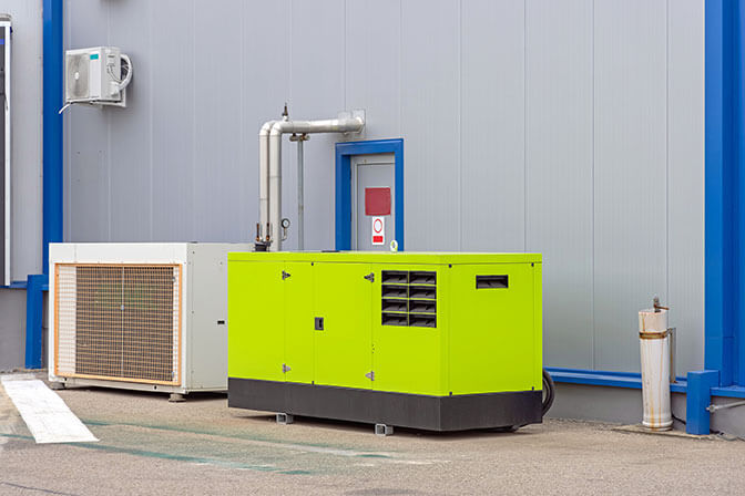Green commercial standby generator at a warehouse